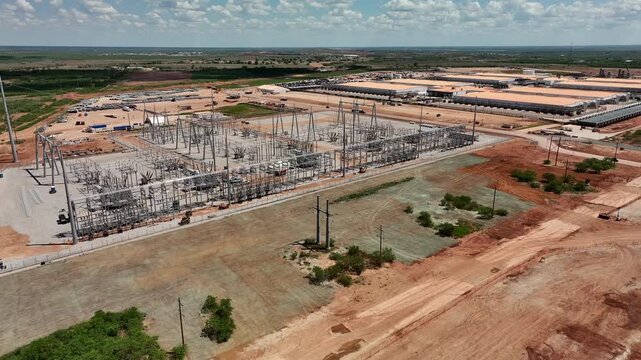 4K aerial drone video of the Stargate data center construction site in Abilene, Texas, showing AI infrastructure, site preparation, graded land, access roads, and construction progress.