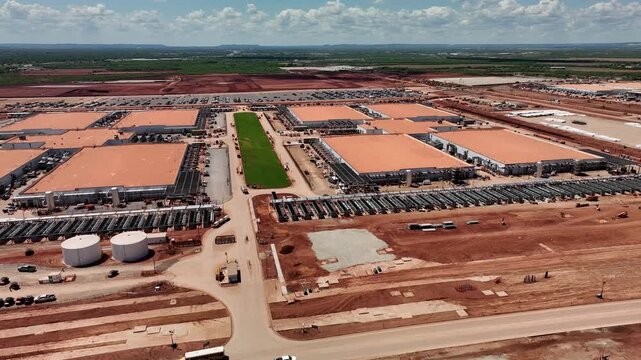 4K aerial drone video of the Stargate data center construction site in Abilene, Texas, showing AI infrastructure, site preparation, graded land, access roads, and construction progress.