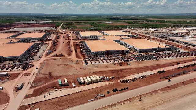 4K aerial drone video of the Stargate data center construction site in Abilene, Texas, showing AI infrastructure, site preparation, graded land, access roads, and construction progress.