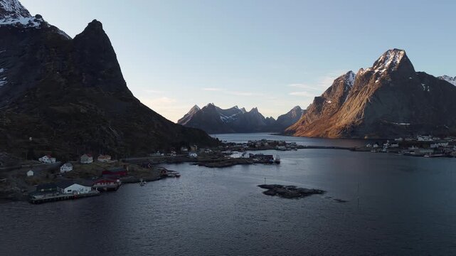 Scenic views of mountains and water at sunset in a coastal village in Norway