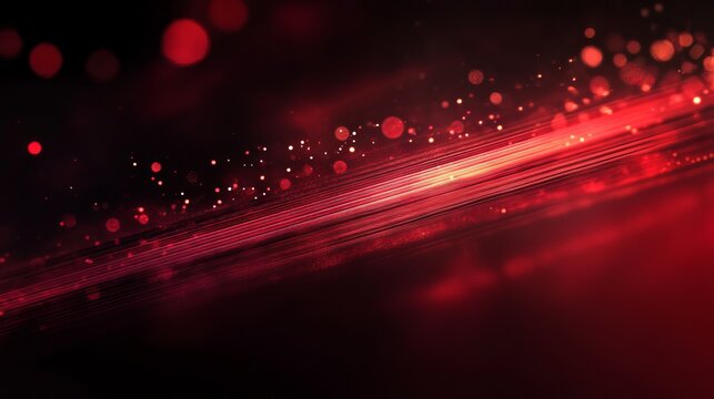 A vibrant red light streaks across a dark background with scattered glowing dots and particles