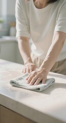 Fototapeta premium Person ironing white shirt on ironing board at home