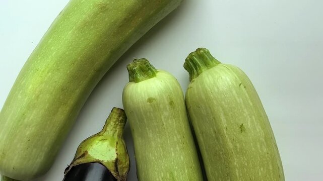 Fresh zucchini and eggplant close up, healthy organic vegetables, natural food background concept.