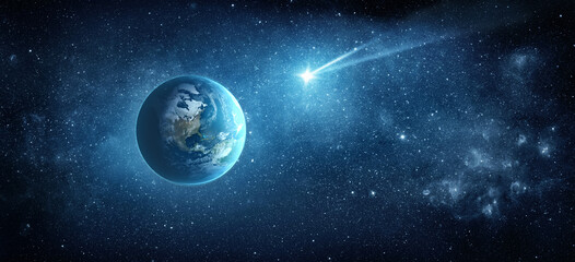 Fototapeta premium Comet, asteroid, meteorite flying to the planet Earth on the background of the starry night sky. Earth. Elements of this image furnished by NASA.
