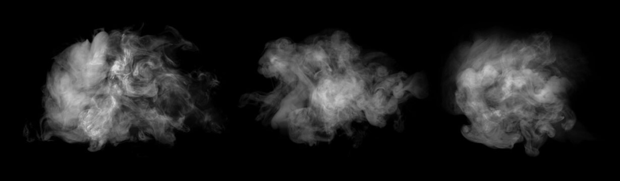 Abstract collection of white steam and smoke clouds isolated on black background. Dramatic swirling vapor textures with soft flowing shapes and atmospheric mist effect.