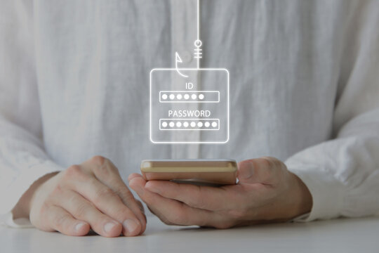 スマホ上でIDとパスワードが盗まれるフィッシング被害に遭っている人物