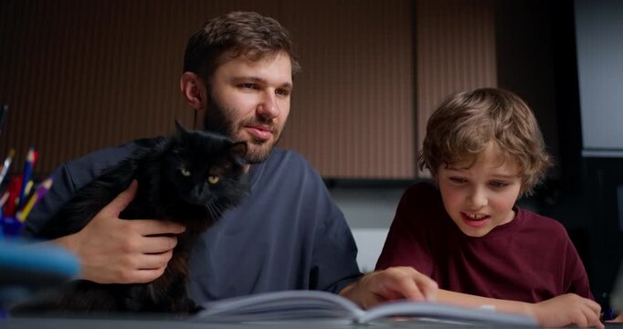 Peaceful Night With Family And Pet Reading. Serene Evening As Father Reads To Son And Feline Companion