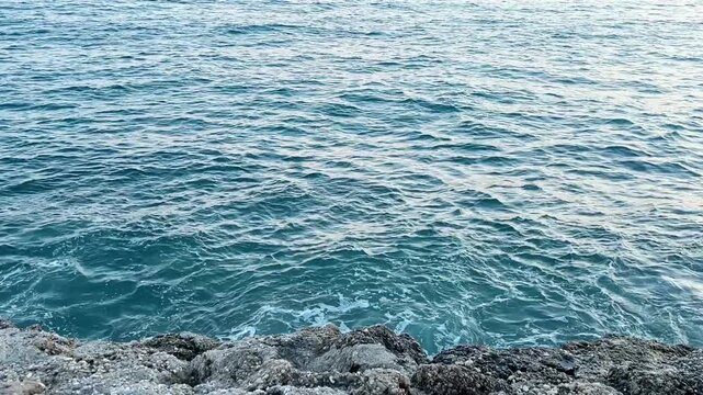 sea ​​coast at sunset, stormy waves