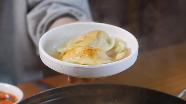 Hot dumpling hot pot served on white plate