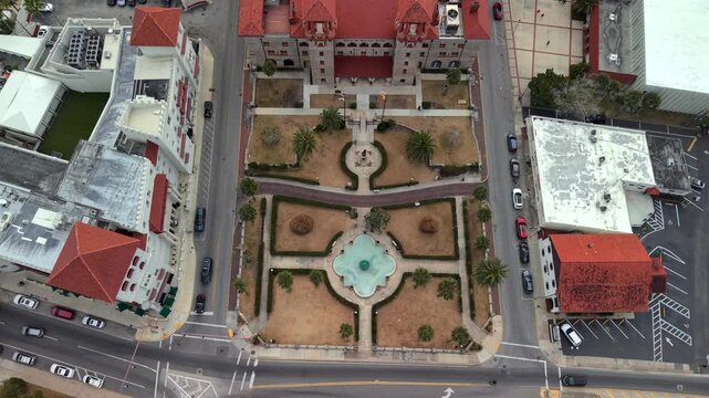 Aerial view of Plaza de la Constitucion with its central fountain, manicured gardens, and surrounding historic architecture in St. Augustine, Florida, United States.