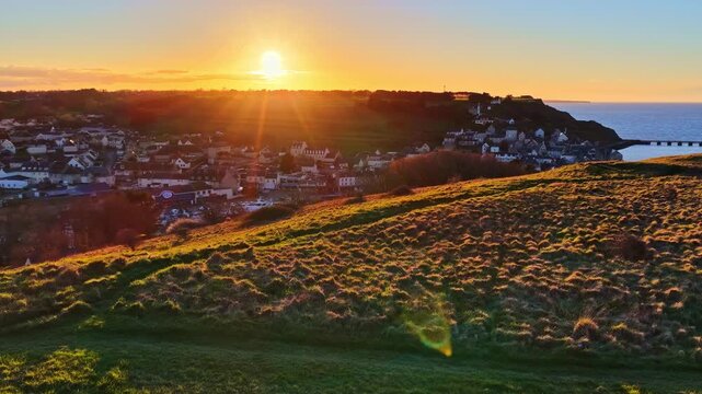 Port en Bessin village, France, at golden sunrise beachside landscape