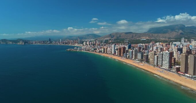 Benidorm spain drone aerial panorama view skyscrapers beach hotels sea line city skyline levante costa blanca tourist destination summer resort coast mediterranean waterfront real estate vacation trav