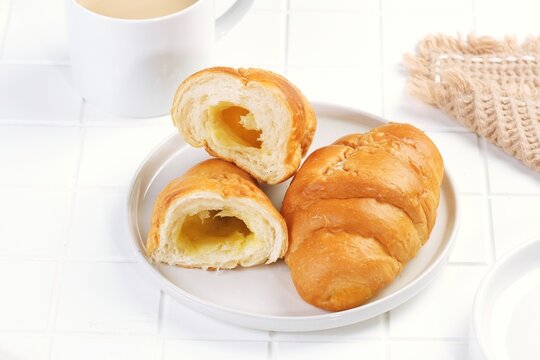 Salt bread, also known as shio pan in Japan and sogeum ppang in Korea, is a popular buttery roll with a crispy salted crust and soft airy interior, perfect for bakery and breakfast concepts.