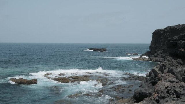 waves crashing on rocks
