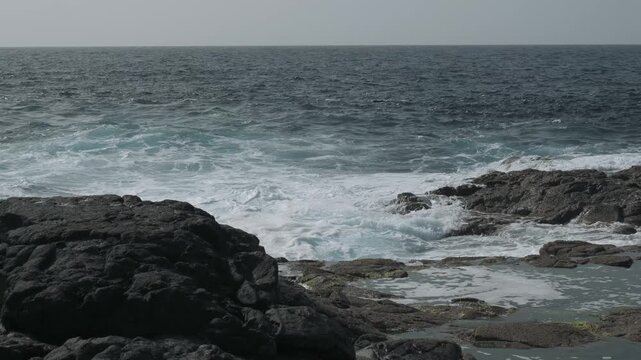 waves crashing on rocks