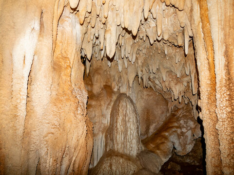 Exploring flowstone and cave formations in Sakalavas cave in Madagascar&rsquo;s limestone