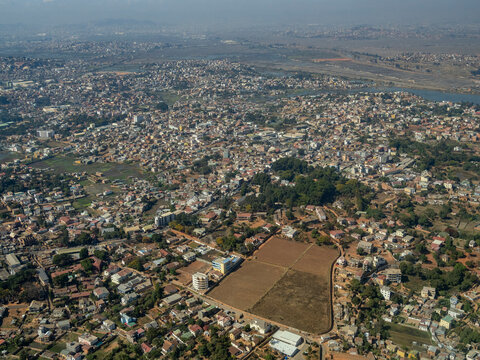 Charter flight travels over city from Isalo National Airport to Antanavarino Charter Flight Base in Madagascar