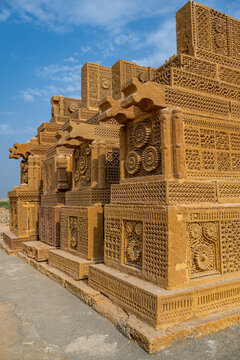 Explore the intricate stone carvings and unique shapes of ancient Chaukhandi tombs found in Karachi, Pakistan during a sunny day