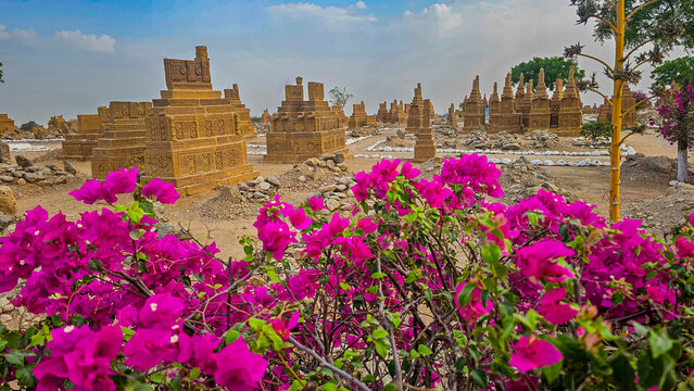 Chaukhandi tombs stand amid blooms and earth in Karachi Pakistan showcasing rich history and culture of Sindh