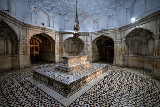 Exploring the interior of the Tomb of Jahangir in Lahore Pakistan showcasing intricate designs and historical architecture in a solemn environment