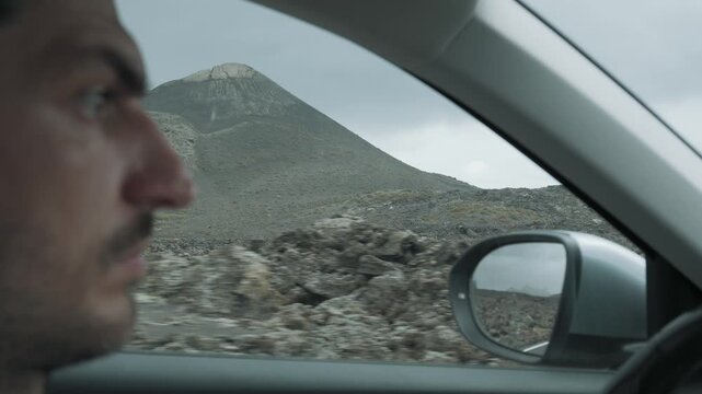 man driving car
