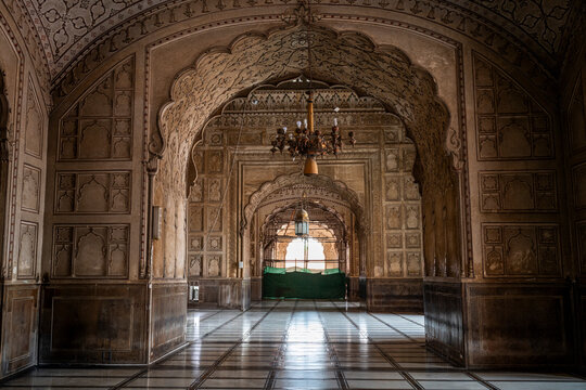 Visit to the interior hall of Badshahi Mosque showing art and architecture during midday in Lahore, Pakistan