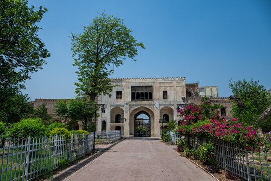Gor Khatri Museum with trees and flowers in Peshawar on a clear day
