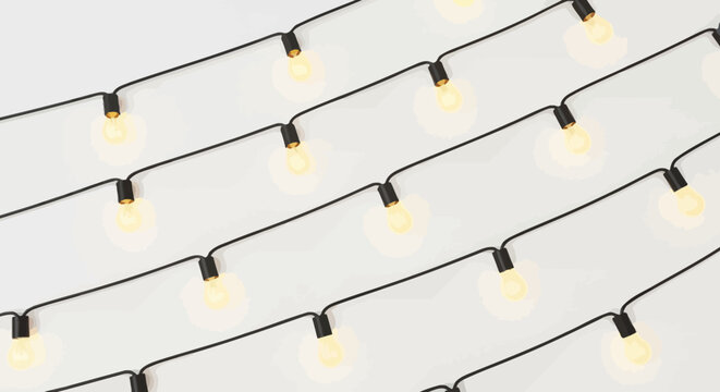 String lights with glowing bulbs black cables on a white background