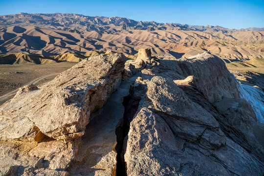 View from the overlook in the Valley of the dragon in Bamyian, Afghanistan with rocky landscape and distant mountains