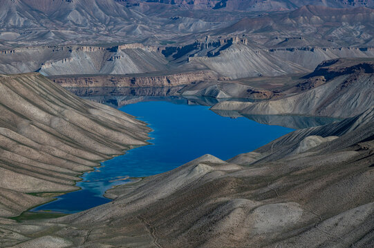 Turquoise lake surrounded by dry hills in Band-e-Amir National Park Afghanistan