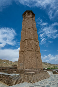 Visit to Ghazni Minarets showcases ancient architecture in Afghanistan under a bright sky with clouds