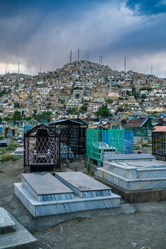 Cemetery surrounding the Blue mosque and Sakhi Shah-e Mardan Shrine in Kabul with city view and tombstones