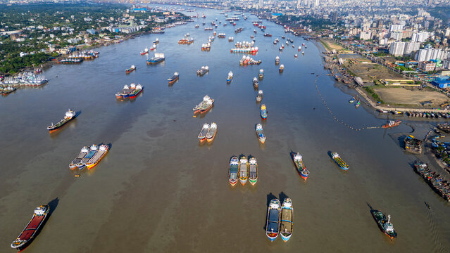 Boats anchor on Karnaphuli River near fish market in Chittagong region of Bangladesh