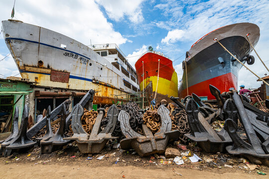 Giant anchors and shipwrecked boats at a shipyard in Dhaka, Bangladesh, showing the remnants of marine activity