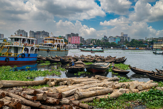 Fishing boats gather on the Buriganga River in Dhaka, Bangladesh during a busy day of trading and transport