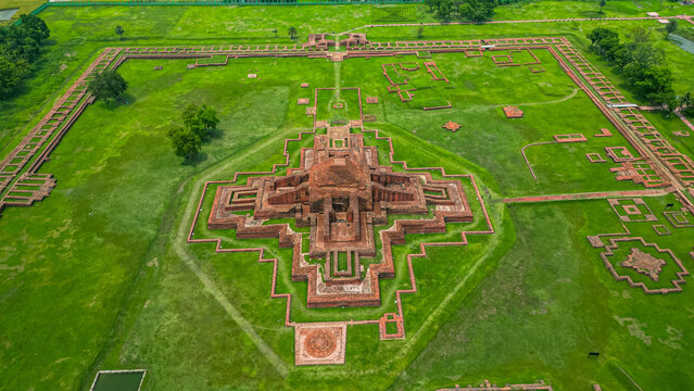 Exploring the ruins of Somapura Mahavihara at Paharpur, significant site in Bangladesh reflecting ancient Buddhist architecture