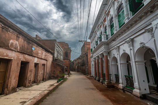 Historic Panam City street lined with old buildings under cloudy sky in Bangladesh