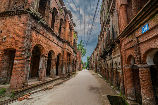 Historic streets of Panam City show remnants of brick buildings from past eras in Bangladesh with an empty pathway
