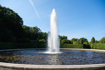 A fountain with a jet of water shooting up into the air © Serg