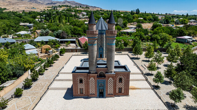 Aerial view of the Mausoleum surrounded by trees and buildings in Garabaghlar, Nakhchivan, Azerbaijan