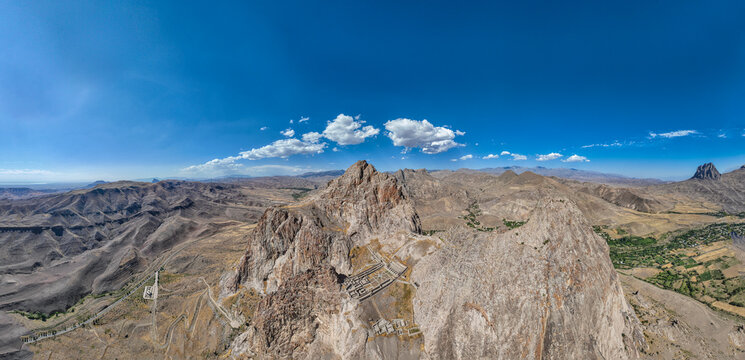 Panorama view of Alinja castle in Nakhchivan showing surrounding mountains and landscape under clear blue sky