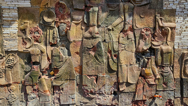 Soviet wall murals showing daily life and culture in Jayabril area of Qarabaqh region in Azerbaijan with water well in focus