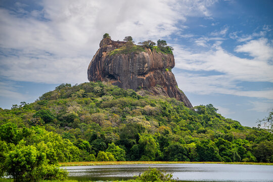 Ancient rock fortress rising above lush greenery in Central Province, Sri Lanka