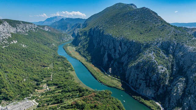 Exploring the shapes of Cetina gorge and river in Croatia with greenery and mountains in view