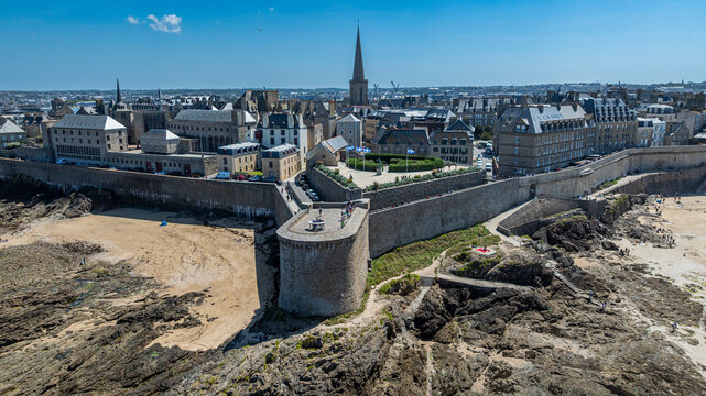 Walled city of Saint-Malo with historic buildings and coastline in Brittany France under clear sky