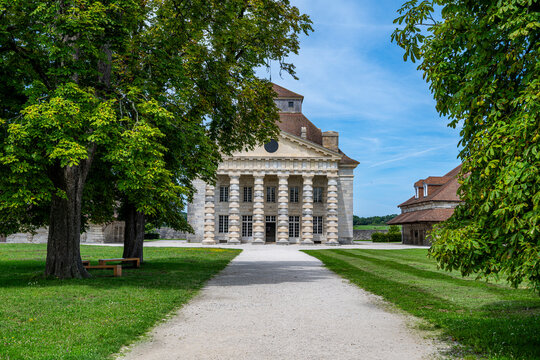 Exploring the Royal Saltworks at Arc et Senans, a UNESCO site in France with historic architecture and lush gardens