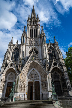 Basilica Saint-Epvre stands tall under a blue sky in Nancy, France, showcasing its intricate architecture and history