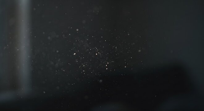Dark background with white specks.