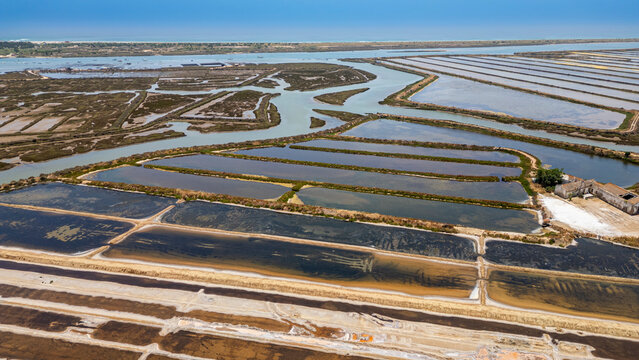 Overview of saltpans showing water channels and salt evaporation processes in Algarve, Portugal