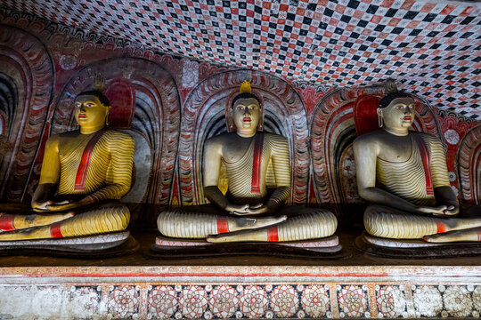 Buddha statues in Dambulla cave temple showing intricate designs from the UNESCO site in Central district of Sri Lanka